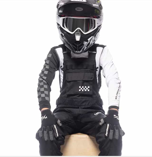 Black Youth Carbon Motorall pants for kids, front view, durable motocross gear