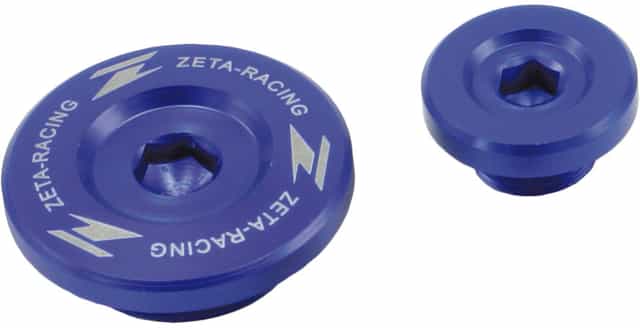 Engine plugs compatible with KXF250 06-10 and RMZ250 04-06, displayed in a clean and professional setting.