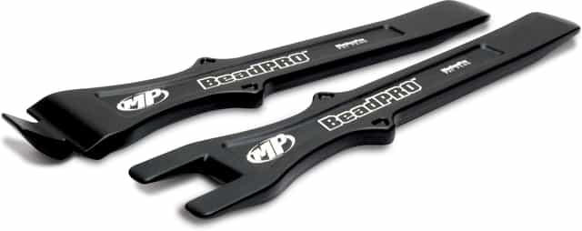 BeadPro Tire Bead Breaker and Lever Tool Set on a wooden workbench, showcasing its durable design and ergonomic handles.