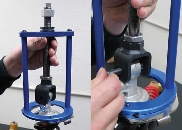 Shock spring compressor tool designed for safely compressing and adjusting coil springs in automotive applications.